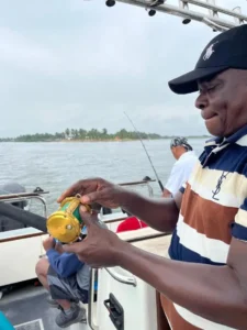 Man handling fishing tackle on a boat
